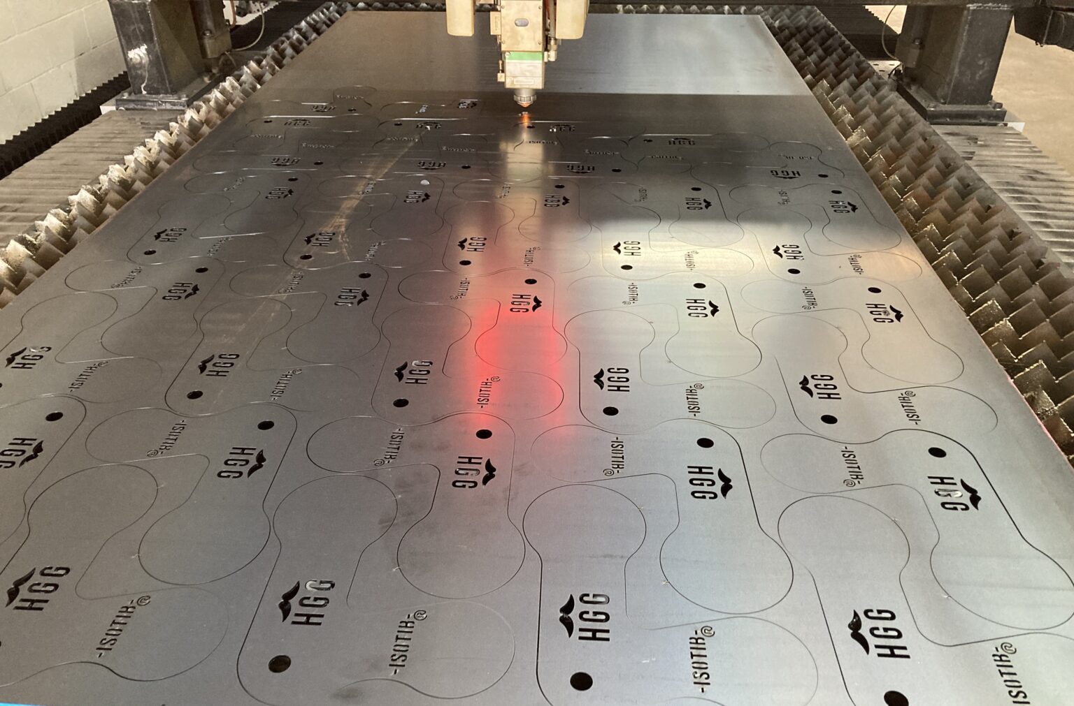 Fibre laser cutting a nested sheet at FIG CNC, Tweed Heads South